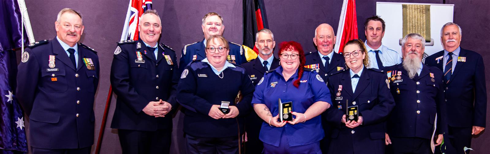 DCO Bill Johnstone, Chief Officer Jason Heffernan, Rochester Captain Luke Warren, Vaughan Thomas, Brent Sweeney, Board Member Peter Shaw AFSM. Front row: Heidi Warren, Hayley Ettershank, Tania Barkby, Raymond Liddicoat